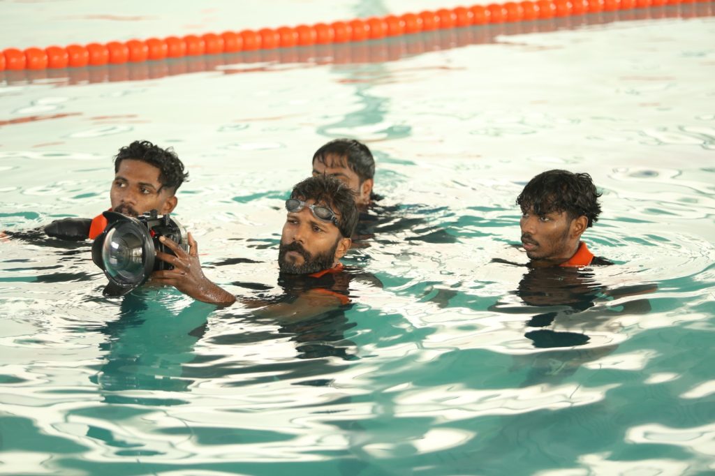 Students learning camera settings during photography courses in kochi at a professional academy